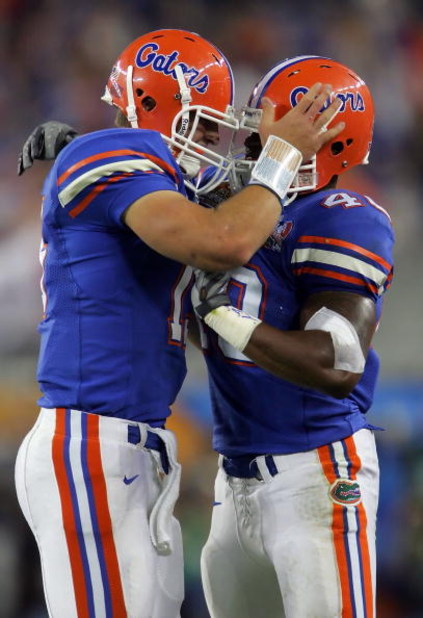 GLENDALE, AZ - JANUARY 08:  (L-R) Quarterback Tim Tebow #15 of the Florida Gators and Brandon Siler #40 celebrate after Tebow threw a one-yard touchdown pass to wide receiver Andre Caldwell #5 of the Florida Gators in the second quarter against the Ohio S