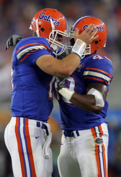 GLENDALE, AZ - JANUARY 08: (L-R) Quarterback Tim Tebow #15 of the Florida Gators and Brandon Siler #40 celebrate after Tebow threw a one-yard touchdown pass to wide receiver Andre Caldwell #5 of the Florida Gators in the second quarter against the Ohio S