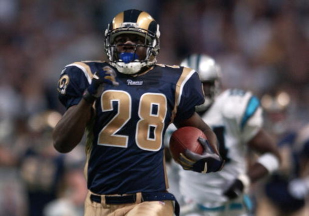11 Nov 2001:  Marshall Faulk #28 of the St. Louis Rams carries the ball in to score a touchdown against the the Carolina Panthers at the Dome at America's Center in St. Louis, Missouri. The Rams defeated the Panthers 48-14. DIGITAL IMAGE. Mandatory Credit