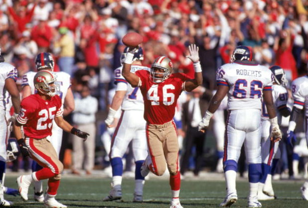 SAN FRANCISCO - JANUARY 15:  Safety Tim McDonald #46 of the San Francisco 49ers celebrates after his 4-yards interception return for a touchdown during the 1993 NFC Championship game against the New York Giants at Candlestick Park on January 15, 1994 in S