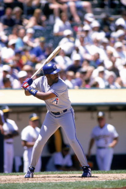 OAKLAND, CA - JUNE 22:  Joe Carter #29 of the Toronto Blue Jays waits for the pitch during the game against the Oakland Athletics at the Oakland-Alameda Coliseum on June 22, 1996 in Oakland, California. The A's defeated the Blue Jays 8-4. (Photo by Otto G