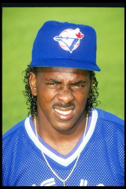 Pitcher Juan Guzman of the Toronto Blue Jay squints his eyes in the sun.