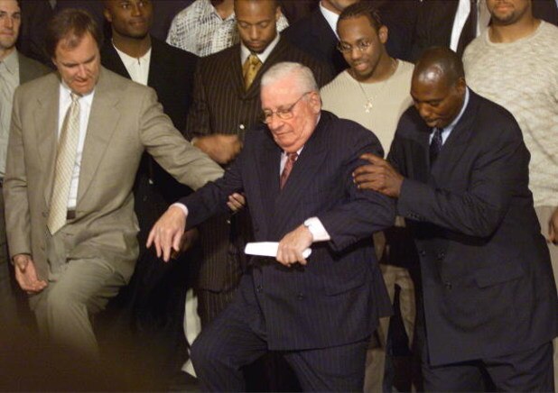 390289 04: Baltimore Ravens owner Art Model, center, gets some help from head coach Brian Billick, left, and Ozzie Newsome during a White House visit June 7, 2001 Washington DC. President Bush hosted the event to honor the World Champion Baltimore Ravens.