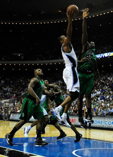 ORLANDO, FL - MARCH 25:  Rashard Lewis #9 of the Orlando Magic attempts a shot over Kendrick Perkins #43 of the Boston Celtics on March 25, 2009 at Amway Arena in Orlando, Florida.  NOTE TO USER: User expressly acknowledges and agrees that, by downloading