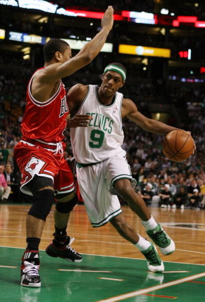 BOSTON - MAY 02:  Rajon Rondo #9 of the Boston Celtics drives around Derrick Rose #1 of the Chicago Bulls in Game Seven of the Eastern Conference Quarterfinals during the 2009 NBA Playoffs at TD Banknorth Garden on May 2, 2009 in Boston, Massachusetts. NO