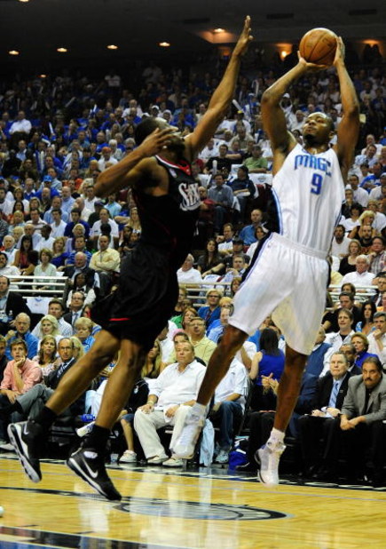 ORLANDO, FL - APRIL 28:  Rashard Lewis #9 of the Orlando Magic shoots over Willie Green #33 of the Philadelphia 76ers in Game Five of the Eastern Conference Quarterfinals during the 2009 NBA Playoffs at Amway Arena on April 28, 2009 in Orlando, Florida. N