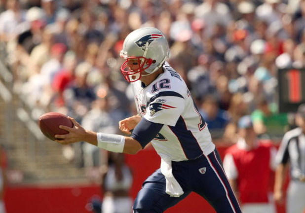 FOXBORO, MA - SEPTEMBER 7:  Quarterback Tom Brady #12 of the New England Patriots looks to hand off the ball during their NFL game against the Kansas City Chiefs on September 7, 2008 at Gillette Stadium in Foxboro, Massachusetts. The Patriots defeated the