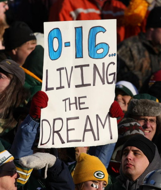 GREEN BAY, WI - DECEMBER 28:  Fans hold a sign during a game between the Green Bay Packers and the Detroit Lions on December 28, 2008 at Lambeau Field in Green Bay, Wisconsin. The Packers defeated the Lions 31-21. (Photo by Jonathan Daniel/Getty Images)