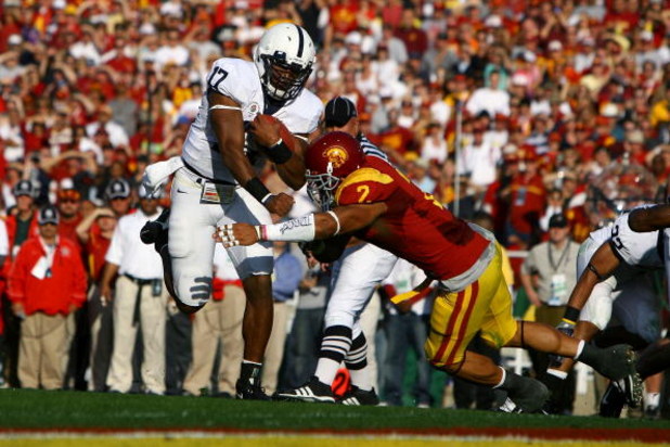 PASADENA, CA - JANUARY 01:  Quarterback Daryll Clark #17 of the Penn State Nittany Lions jumps over Taylor Mays #2 of the USC Trojans to score a touchdown in the first quarter of the 95th Rose Bowl Game presented by Citi on January 1, 2009 at the Rose Bow
