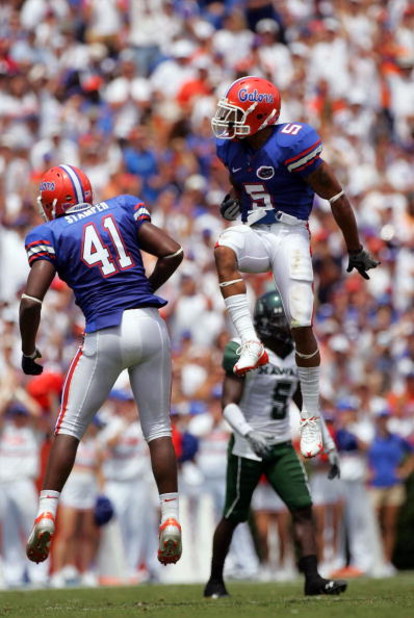 GAINESVILLE, FL - AUGUST 30:  Defensive back Joe Haden #5 and linebacker Ryan Stamper #41 of the Florida Gators celebrate during a game against the Hawaii Warriors at Ben Hill Griffin Stadium on August 30, 2008 in Gainesville, Florida.  (Photo by Sam Gree
