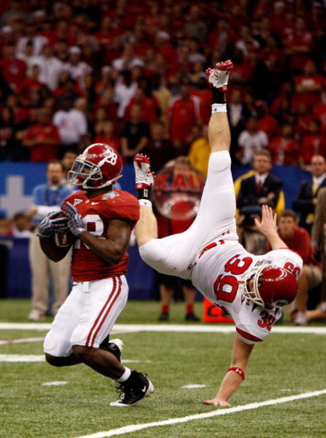 NEW ORLEANS - JANUARY 02:  Kick returner Javier Arenas #28 of the Alabama Crimson Tide fields a punt as he is interfered by Clint Mower #39 of the Utah Utes as Mower flips over during the 75th Allstate Sugar Bowl at the Louisiana Superdome on January 2, 2