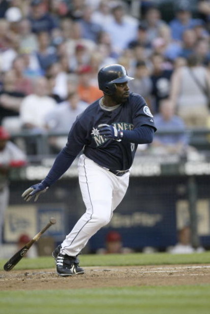 SEATTLE - JULY 3:  Designated hitter Carl Everett #8 of the Seattle Mariners swings at a Los Angeles Angels of Anaheim pitch during the game on July 3, 2006 at Safeco Field in Seattle Washington. The Angeles won 7-3.  (Photo by Otto Greule Jr/Getty Images