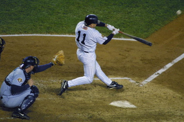 BRONX, NY - OCTOBER 22:  Leftfielder Chuck Knoblauch #11 of the New York Yankees hits the ball against the Seattle Mariners during game five of the American League Championship Series on October 22, 2001 at Yankee Stadium in the Bronx, New York.  The Yank