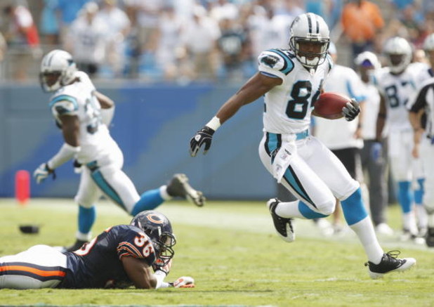 CHARLOTTE, NC - SEPTEMBER 14:  Mark Jones #84 of the Carolina Panthers runs the ball against Brandon McGowan #36 of the Chicago Bears during their NFL game at Bank of America Stadium in Charlotte, North Carolina on September 14, 2008. (Photo by: Streeter 