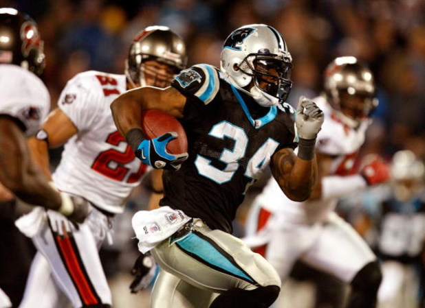 CHARLOTTE, NC - DECEMBER 08:  DeAngelo Williams #34 of the Carolina Panthers runs with the ball during their game against the Tampa Bay Buccaneers at Bank of America Stadium on December 8, 2008 in Charlotte, North Carolina.  (Photo by Streeter Lecka/Getty