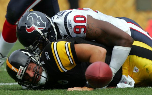PITTSBURGH - SEPTEMBER 07:  Quarterback Ben Roethlisberger #17 of the Pittsburgh Steelers fumbles the ball while sacked by Mario Williams #90 of the Houston Texans on September 7, 2008 at Heinz Field in Pittsburgh, Pennsylvania.  (Photo by Ronald Martinez