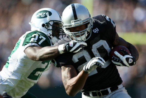 OAKLAND, CA - OCTOBER 19:  Darren McFadden #20 of the Oakland Raiders runs against Abram Elam #27 of the New York Jets during an NFL game on October 19, 2008 at the Oakland-Alameda County Coliseum in Oakland, California.  (Photo by Jed Jacobsohn/Getty Ima