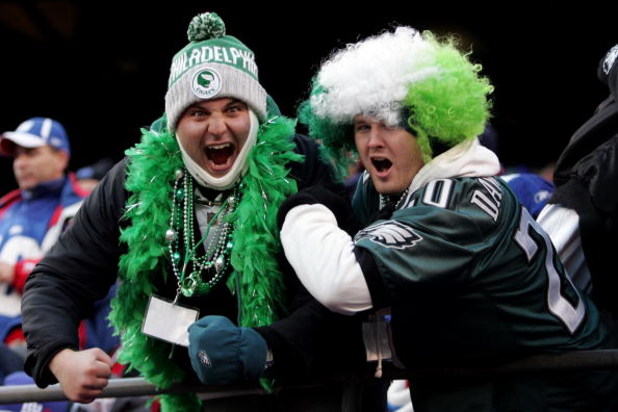 EAST RUTHERFORD, NJ - JANUARY 11:  Fans of the Philadelphia Eagles celebrate against the New York Giants during the NFC Divisional Playoff Game on January 11, 2009 at Giants Stadium in East Rutherford, New Jersey.  (Photo by Michael Heiman/Getty Images)
