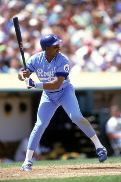 OAKLAND, CA - 1990:  Frank White #20 of the Kansas City Royals stands ready at the plate during a game against the Oakland Athletics at Oakland-Alameda County Coliseum in 1990 in Oakland, California.  (Photo by Otto Greule Jr/Getty Images)