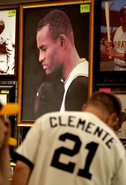 PITTSBURGH - JULY 7: Fans look over Roberto Clemente memorabilia during opening day of Fan Fest for the Major League Baseball 2006 All-Star game at the David L. Lawrence Convention Center July 7, 2006 in Pittsburgh, Pennsylvania. (Photo by Paul Hawthorne/