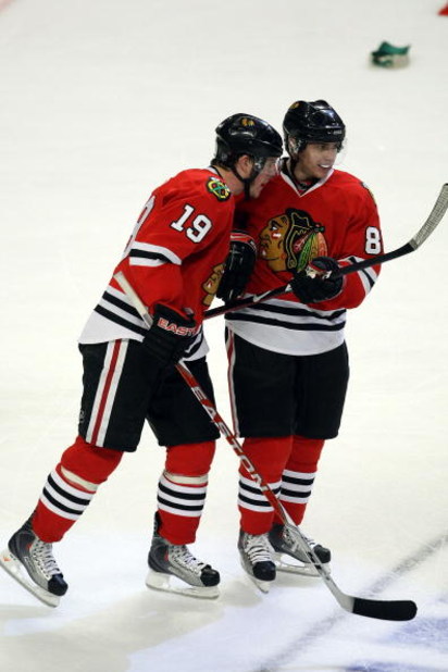 CHICAGO - MAY 11:  (L-R) Jonathan Toews #19 and Patrick Kane #88 of the Chicago Blackhawks celebrate after Kane scored his third goal of the game to record a hat trick against the Vancouver Canucks during the third period Game Six of the Western Conferenc