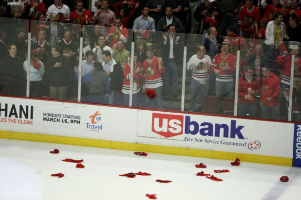 CHICAGO - MAY 11:  Fans of the Chicago Blackhawks throws hats and towels on the ice after Patrick Kane #88 scored a hat trick goal in the third period against the Vancouver Canucks during Game Six of the Western Conference Semifinal Round of the 2009 Stan