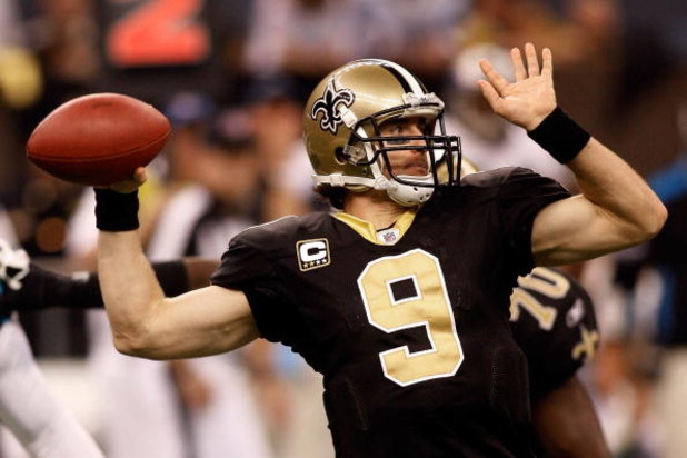 NEW ORLEANS - DECEMBER 28:  Drew Brees #9 of the New Orleans Saints looks to throw a pass against the Carolina Panthers on December 28, 2008 at the Superdome in New Orleans, Louisiana.  (Photo by Chris Graythen/Getty Images)