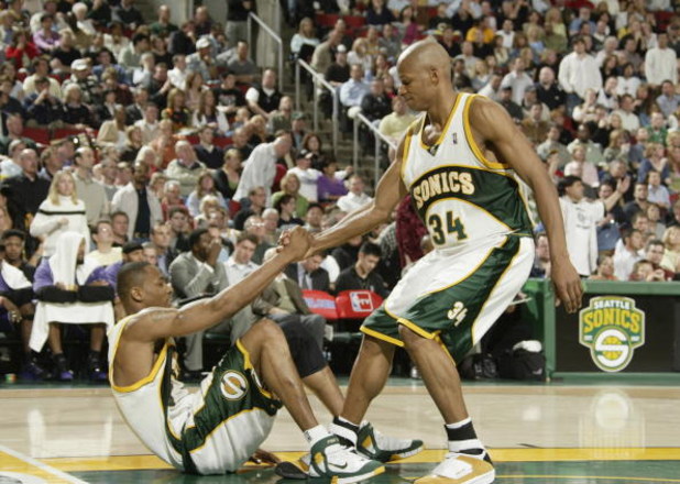 SEATTLE - APRIL 23:  Rashard Lewis #7 of the Seattle SuperSonics is helped off the floor by teammate Ray Allen #34 in Game one of the Western Conference Quarterfinals against the Sacramento Kings during the 2005 NBA Playoffs on April 23, 2005 at Key Arena
