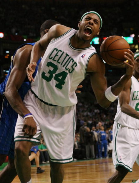 BOSTON - MAY 04:  Paul Pierce #34 of the Boston Celtics tries to keep maintain possession as Dwight Howard #12 of the Orlado Magic defends in Game One of the Eastern Conference Semifinals during the 2009 NBA Playoffs at TD Banknorth Garden on May 4, 2009 