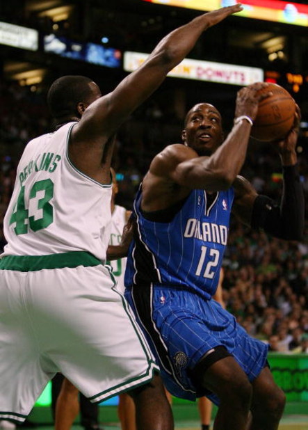 BOSTON - MAY 12:  Dwight Howard #12 of the Orlando Magic drives to the net as Kendrick Perkins #43 of the Boston Celtics defends in Game Five of the Eastern Conference Semifinals during the 2009 NBA Playoffs at TD Banknorth Garden May 12, 2009 in Boston, 