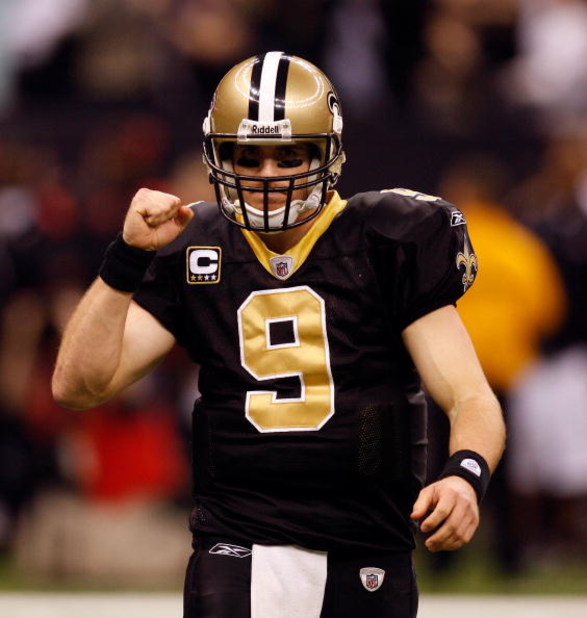 NEW ORLEANS - DECEMBER 28:  Quarterback Drew Brees #9 of the New Orleans Saints pumps his fist during the game against the Carolina Panthers on December 28, 2008 at the Superdome in New Orleans, Louisiana.  (Photo by Chris Graythen/Getty Images)