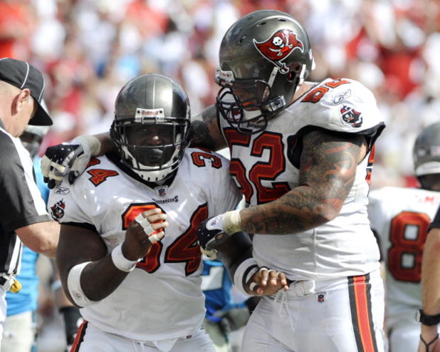 TAMPA, FL - OCTOBER 12: Running back Earnest Graham #34 of  the Tampa Bay Buccaneers celebrates a touchdown with center Jeff Faine #52 against the Carolina Panthers at Raymond James Stadium on October 12, 2008 in Tampa, Florida.  (Photo by Al Messerschmid