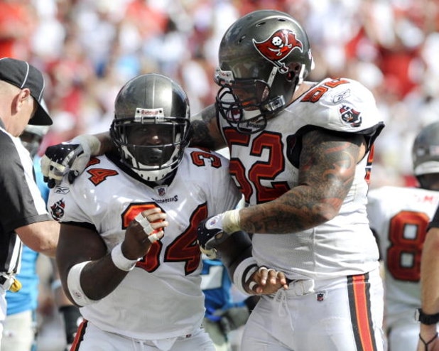 TAMPA, FL - OCTOBER 12: Running back Earnest Graham #34 of the Tampa Bay Buccaneers celebrates a touchdown with center Jeff Faine #52 against the Carolina Panthers at Raymond James Stadium on October 12, 2008 in Tampa, Florida. (Photo by Al Messerschmid