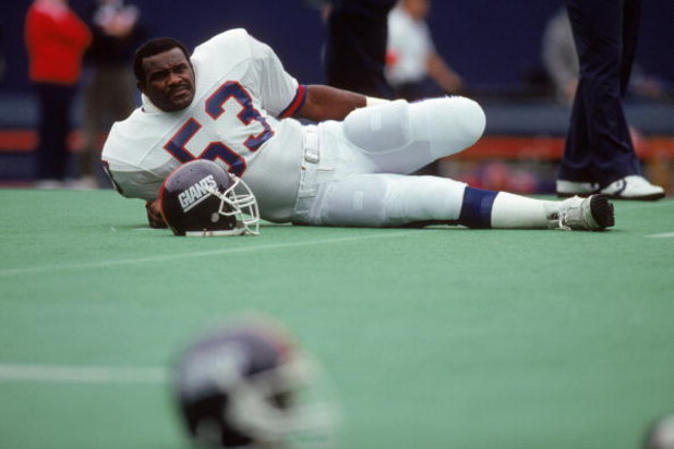 UNDATED:  Linebacker Harry Carson #53 of the New York Giants takes a breather as he reclines on the field prior to a game circa 1980's. Carson played for the Giants from 1976-88. (Photo by T.G. Higgins/Getty Images)