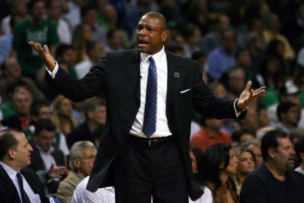 BOSTON - MAY 12:  Head coach Doc Rivers of the Boston Celtics reacts to a foul called against Kendrick Perkins #43 of the Celtics in the first quarter against the Orlando Magic  in Game Five of the Eastern Conference Semifinals during the 2009 NBA Playoff