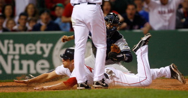 BOSTON - APRIL 26: Jacoby Ellsbury #46 of the Boston Red Sox steals home under the tag by Jorge Posada #20 of the New York Yankees at Fenway Park April 26, 2009 in Boston, Massachusetts. Jacoby Ellsbury recorded the first steal of home by a Red Sox player