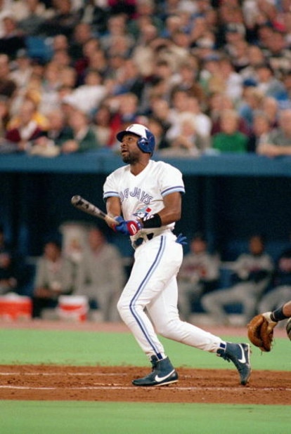 TORONTO - OCTOBER 20: Joe Carter #29 of the Toronto Blue Jays hits a solo home run against the Atlanta Braves in the fourth inning of game three of the 1992 World Series at Skydome on October 20, 1992 in Toronto, Ontario, Canada. The Blue Jays defeated t