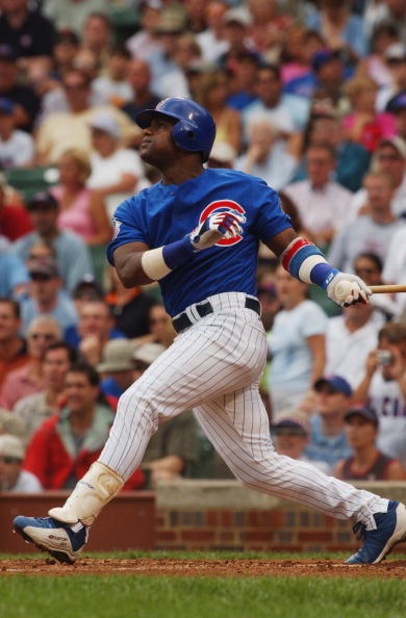 CHICAGO - JULY 16:  Sammy Sosa #21 of the Chicago Cubs bats during a game against the Milwaukee Brewers on July 16, 2004 at Wrigley Field in Chicago, Illinois.  The Brewers defeated the Cubs 3-2.  (Photo by Jonathan Daniel/Getty Images)