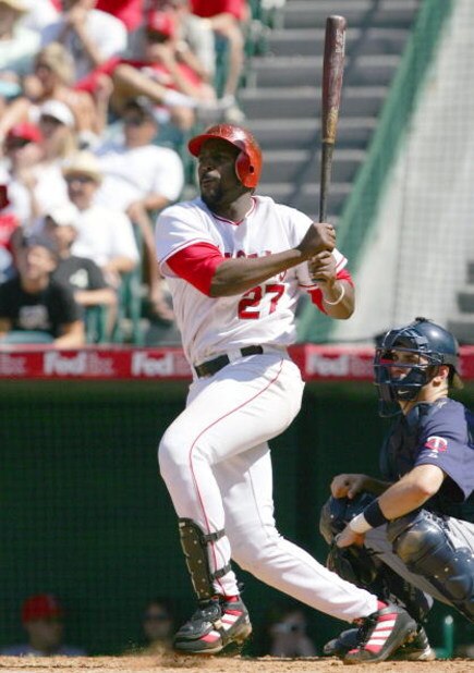 ANAHEIM, CA - JULY 6: Vladimir Guerrero #27 of the Los Angeles Angels of Anaheimhits a single in the 9th inning against the Minnesota Twins on July 6, 2005 at Angel Stadium in Anaheim, California. The Angels won 7-6. (Photo by Lisa Blumenfeld/Getty Ima