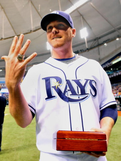 ST. PETERSBURG, FL - APRIL 14: Pitcher Scott Kazmir #19 of the Tampa Bay Rays shows off his 2008 AL championship ring before play against the New York Yankees April 14, 2009 in St. Petersburg, Florida. (Photo by Al Messerschmidt/Getty Images)