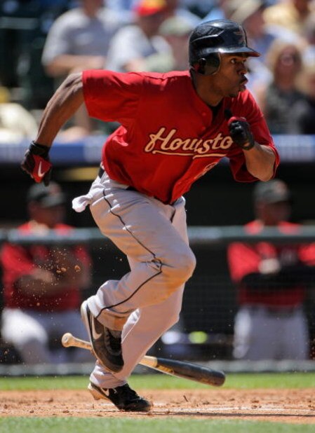 DENVER - MAY 14: Michael Bourn #21 of the Houston Astros singles to lead off the third inning against the Colorado Rockies during MLB action at Coors Field on May 14, 2009 in Denver, Colorado. Bourn was four for five and scored twice as the Astros defeat