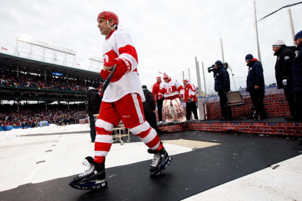 CHICAGO - JANUARY 01:  Chris Chelios #24 of the Detroit Red Wings walks back towards the dugout against the Chicago Blackhawks during the NHL Winter Classic at Wrigley Field on January 1, 2009 in Chicago, Illinois.  (Photo by Jamie Squire/Getty Images)