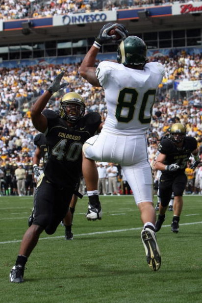 DENVER - SEPTEMBER 1:  Kory Sperry #80 of the Colorado State Rams catches a touchdown pass against Brad Jones #40 of the Colorado Buffaloes at INVESCO Field at Mile High on September 1, 2007 in Denver, Colorado. Colorado won 31-28 in overtime. (Photo by D
