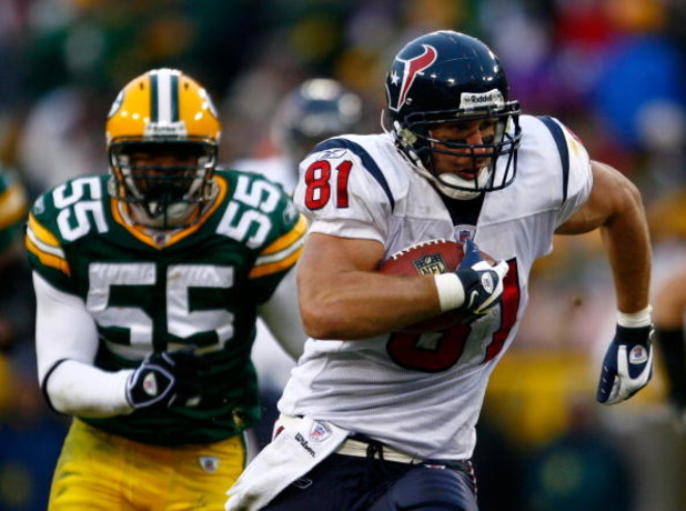 GREEN BAY, WI - DECEMBER 07:  Owen Daniels #81 of the Houston Texans carries the ball while being pursued by Desmond Bishop #55 of the Green Bay Packers during the fourth quarter at Lambeau Field on December 7, 2008 in Green Bay, Wisconsin. The Texans def