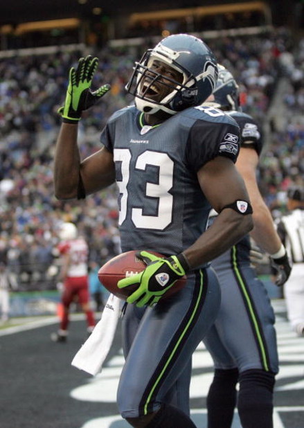 SEATTLE - DECEMBER 9: Deion Branch #83 of the Seattle Seahawks celebrates the touchdown against the Arizona Cardinals December 9, 2007 at Qwest Field in Seattle, Washington. The Seahawks defeated the Cardinals 42-21. (Photo by Otto Greule Jr/Getty Images)