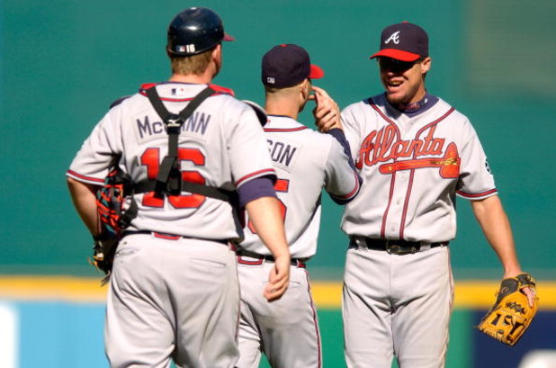 WASHINGTON - SEPTEMBER 16:  Chipper Jones #10 of the Atlanta Braves congratulates Tim Hudson #15 after beating the Washington Nationals 3-0 at RFK Stadium September 16, 2007 in Washington, DC.   Hudson pitched a complete game shutout. (Photo by Greg Fiume