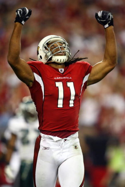 GLENDALE, AZ - JANUARY 18:  Wide receiver Larry Fitzgerald #11 of the Arizona Cardinals reacts after teammate Tim Hightower #34 scored a touchdown in the fourth quarter against the Philadelphia Eagles during the NFC championship game on January 18, 2009 a