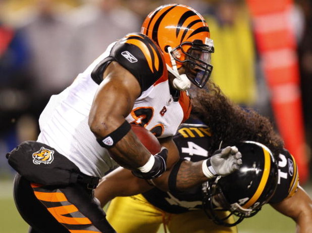PITTSBURGH - NOVEMBER 20:  Cedric Benson #32 of the Cincinnati Bengals gets tackled by Troy Polamalu #43 of the Pittsburgh Steelers during a first quarter run on November 20, 2008 at Heinz Field in Pittsburgh, Pennsylvania. Pittsburgh won the game 27-10. 