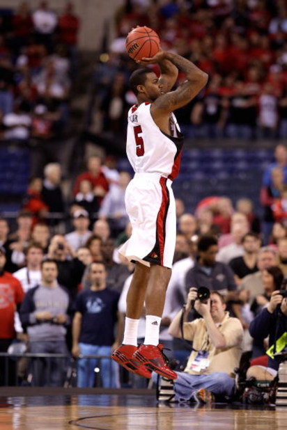 INDIANAPOLIS - MARCH 27:  Earl Clark #5 of the Louisville Cardinals attempts a shot against the Arizona Wildcats during the third round of the NCAA Division I Men's Basketball Tournament at the Lucas Oil Stadium on March 27, 2009 in Indianapolis, Indiana.