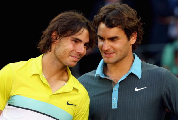 MADRID, SPAIN - MAY 17:  Roger Federer of Switzerland (R) and Rafael Nadal of Spain share a moment during the prize giving ceremony after the mens final during the Madrid Open tennis tournament at the Caja Magica on May 17, 2009 in Madrid, Spain.  (Photo 